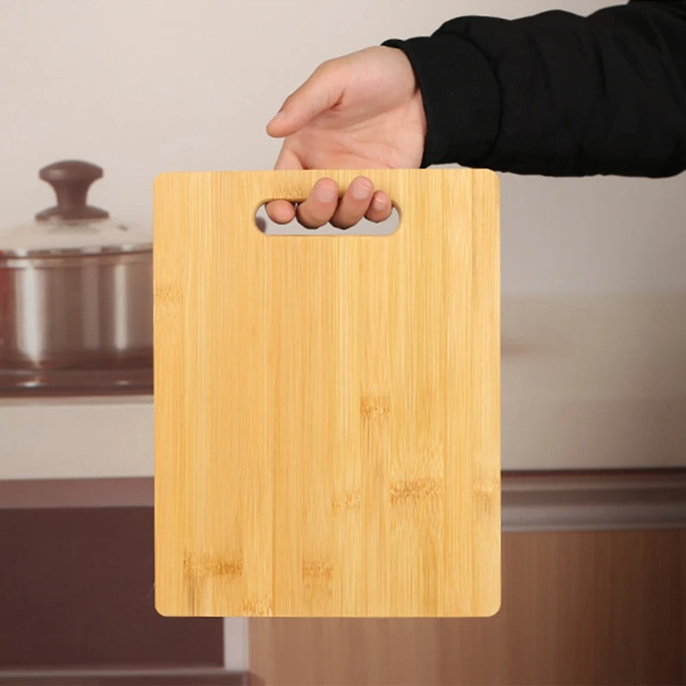 Light brown bamboo cutting board with handle slot
