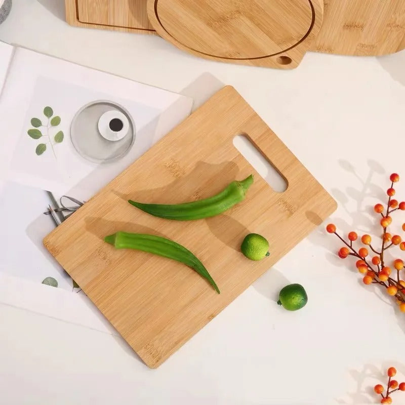 Light brown bamboo cutting board with handle slot