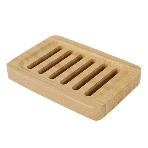 Light brown bamboo soap holder with slotted surface