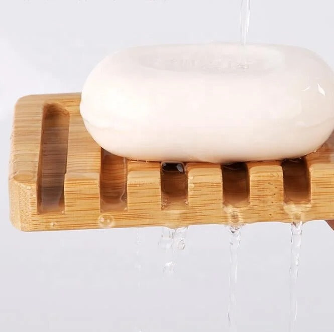 Light brown bamboo soap holder with slotted surface
