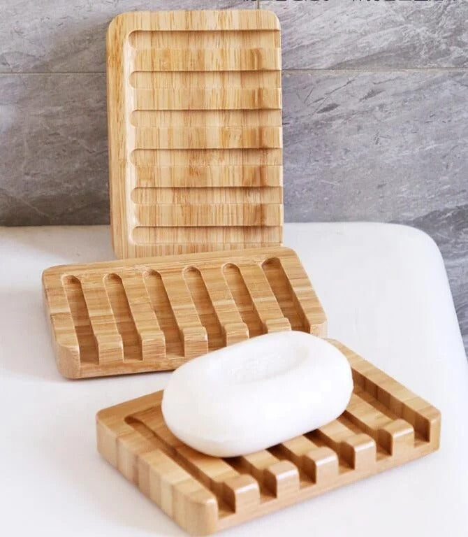 Light brown bamboo soap holder with slotted surface