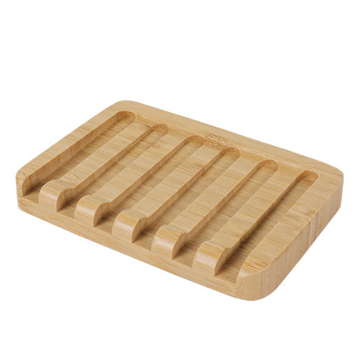 Light brown bamboo soap holder with slotted surface
