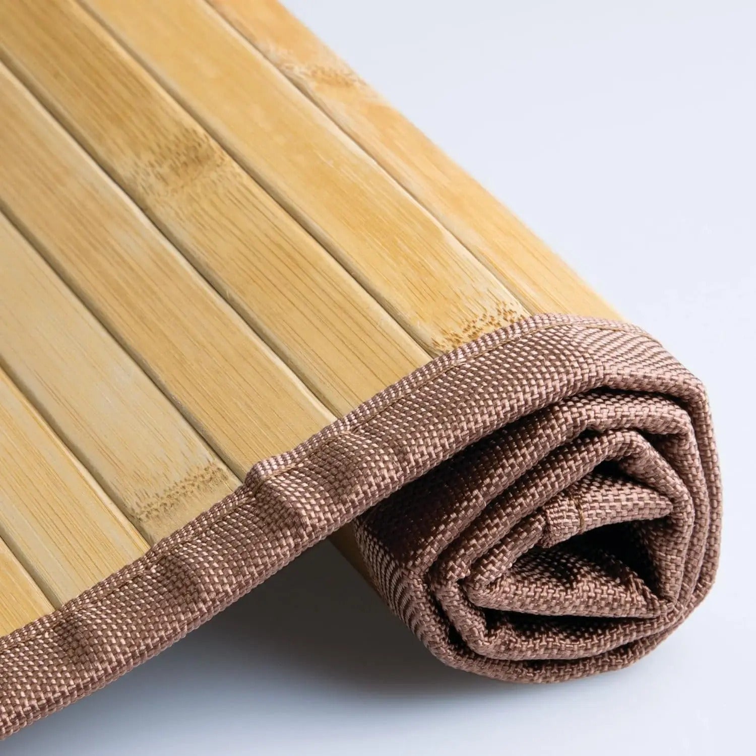Light brown slatted mat with brown fabric border