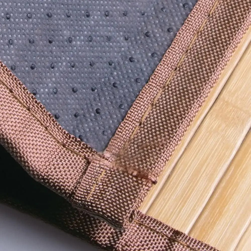 Light brown slatted mat with brown fabric border